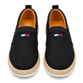 Straight-on black slip-on sneakers with beige woven-look trim and white soles