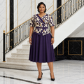 Black Nigerian woman wearing aubergine printed wrap-bodice dress