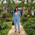 Nigerian female model wearing women's powder blue two-piece blazer suit set – lifestyle shot