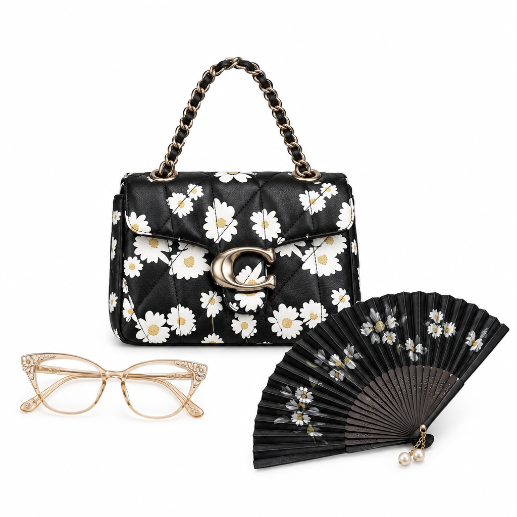 Black daisy handbag with eyeglasses and folding fan on white