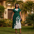 Women's emerald green botanical print lace collar pleated midi gown – Nigerian model lifestyle shot