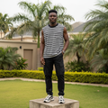 Nigerian male model wearing black and white striped sleeveless vest – full body lifestyle shot