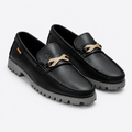 Black men's woven-detail lug-sole loafers shown as a complete pair