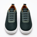 Straight-on dark green elastic-band sneakers with lighter green trim and white soles