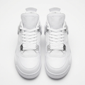 Front view of white mesh-panel mid-top sneaker pair with metallic lace supports