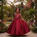 Young Nigerian girl wearing wine red sequin bow satin party dress