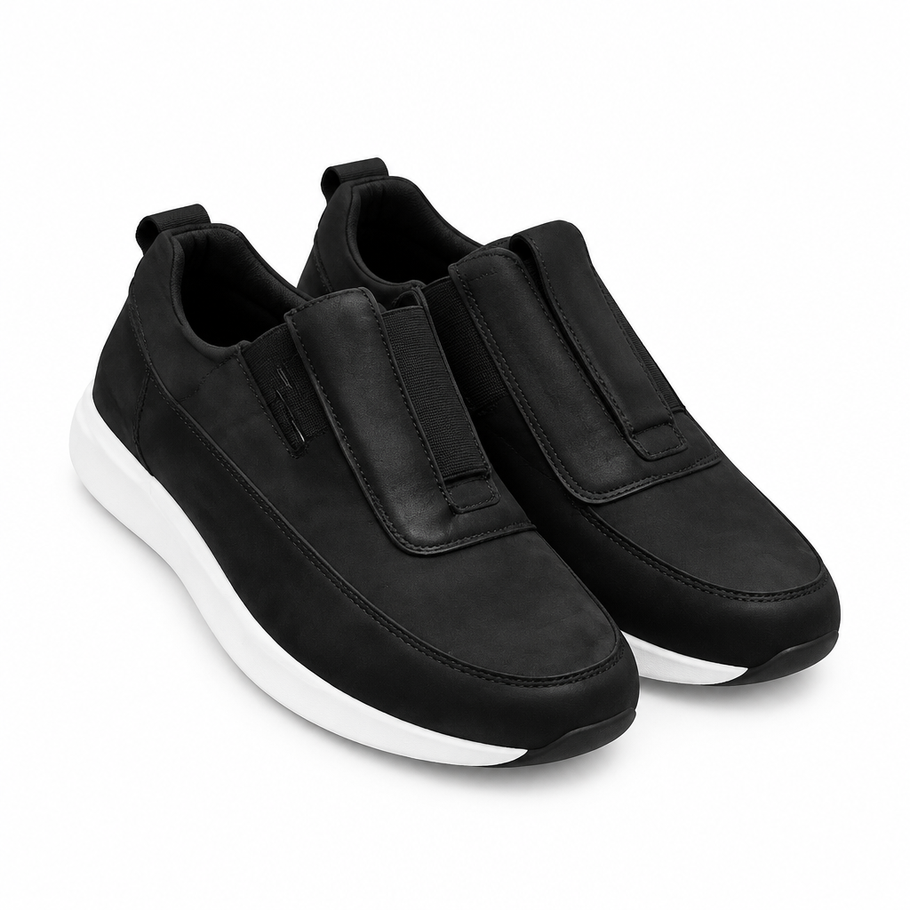 Pair of black slip-on shoes with contrasting white soles
