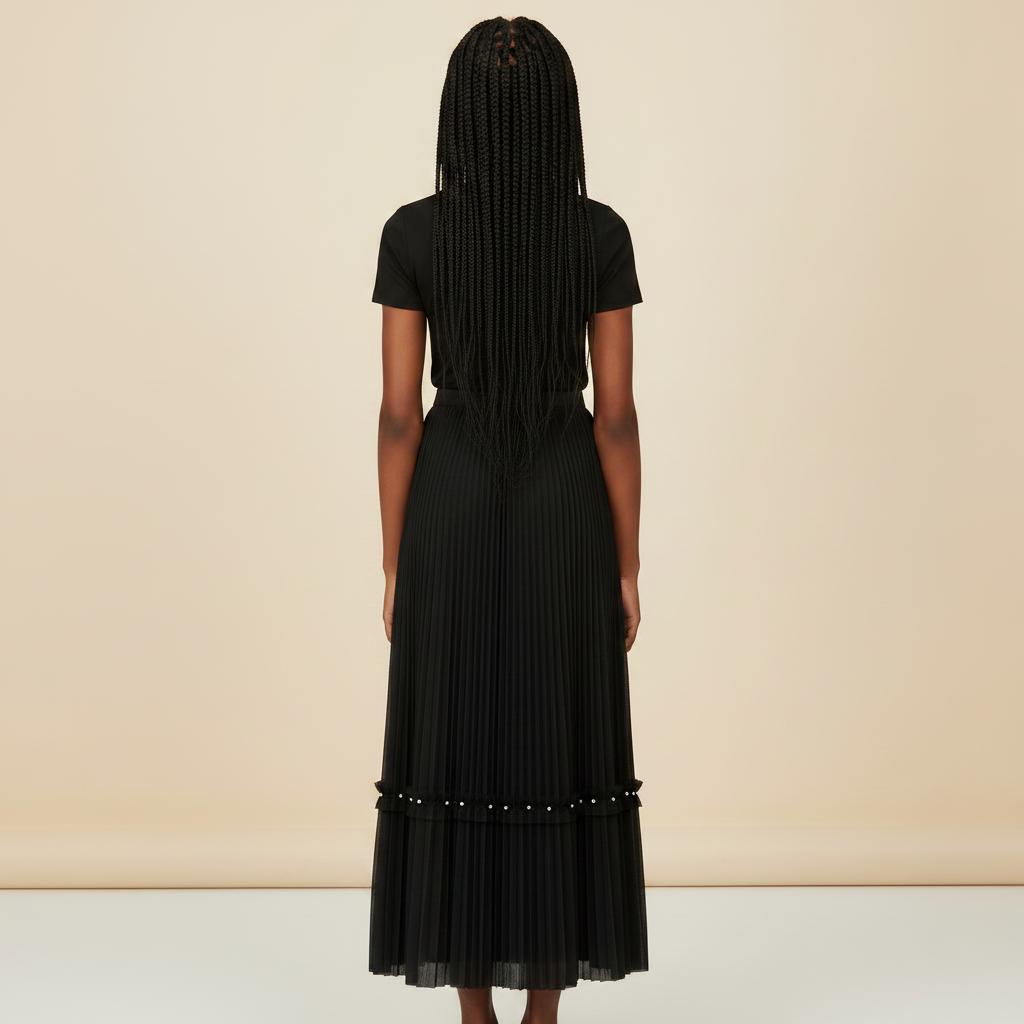 Nigerian girl wearing black pleated midi skirt - back view
