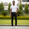 Nigerian male model wearing solid black slim straight denim jeans