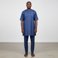Black Nigerian model wearing the navy Senator Wear set