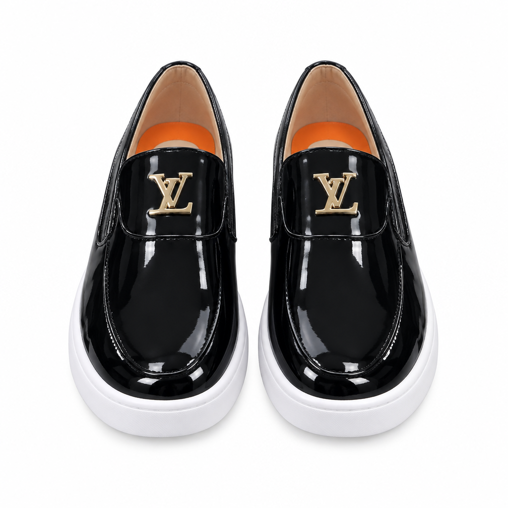 Front view of glossy black slip-on shoes with gold-tone details and white soles