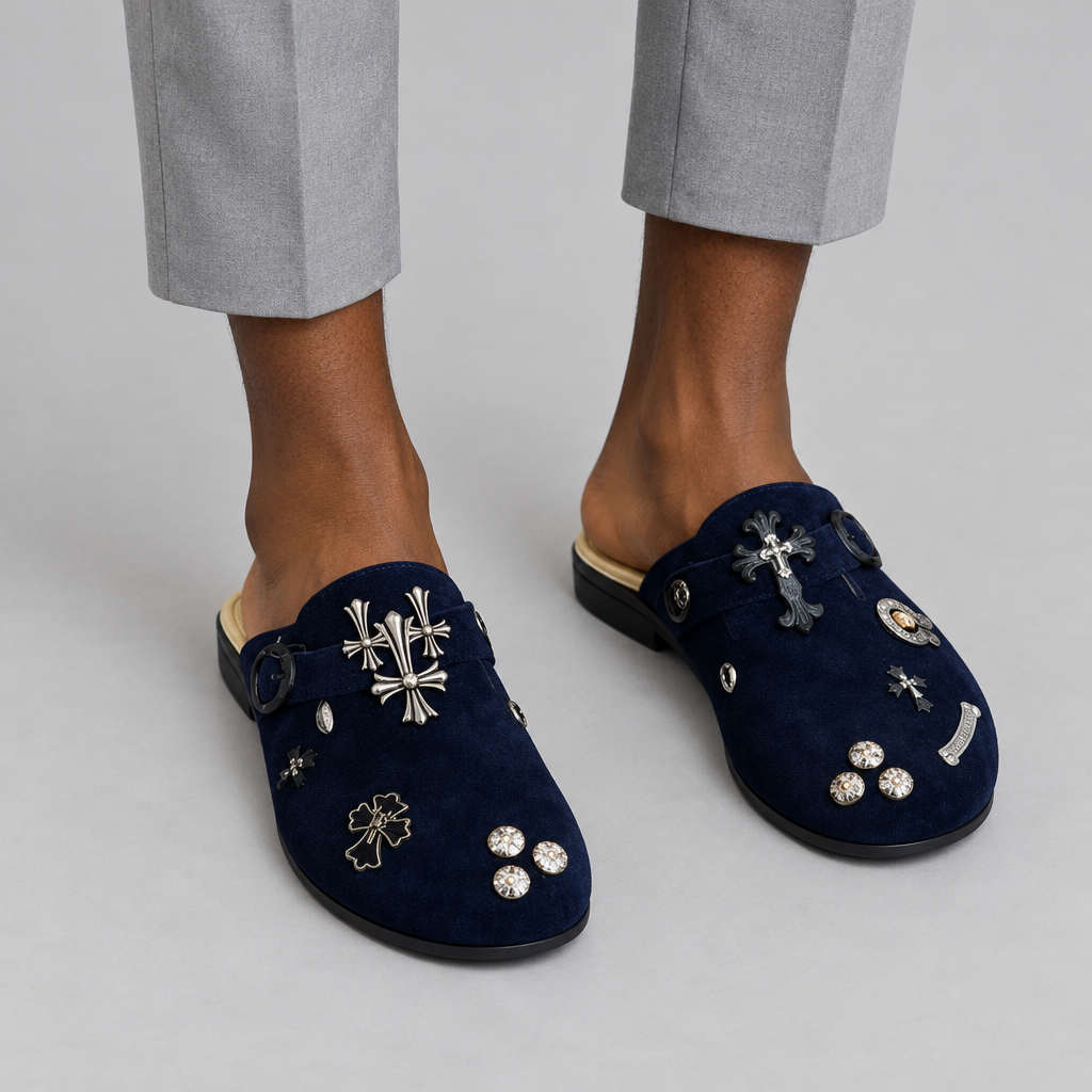 Lower-leg view of Nigerian man wearing navy embellished open-back mules, both shoes visible