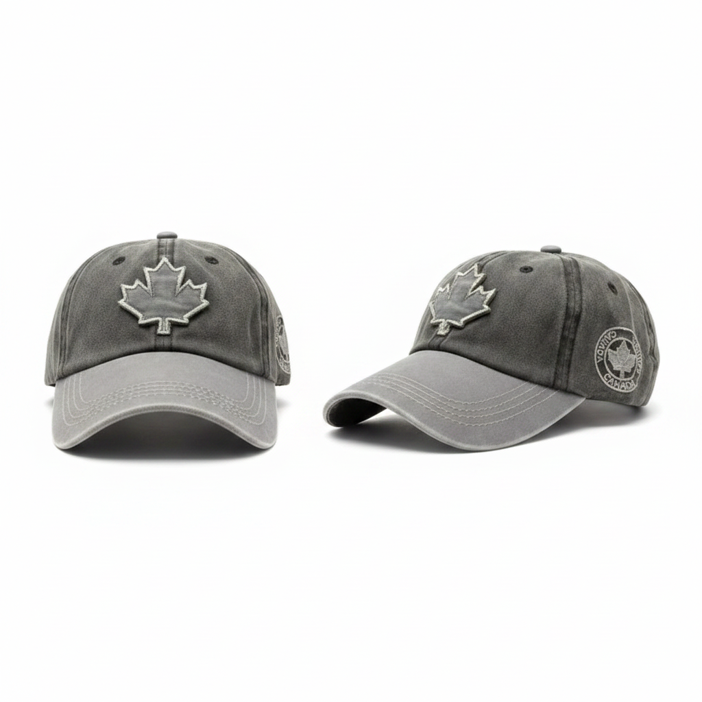 Two-tone washed charcoal grey baseball cap with maple leaf and Canada badge patches – ghost mannequin front and side view