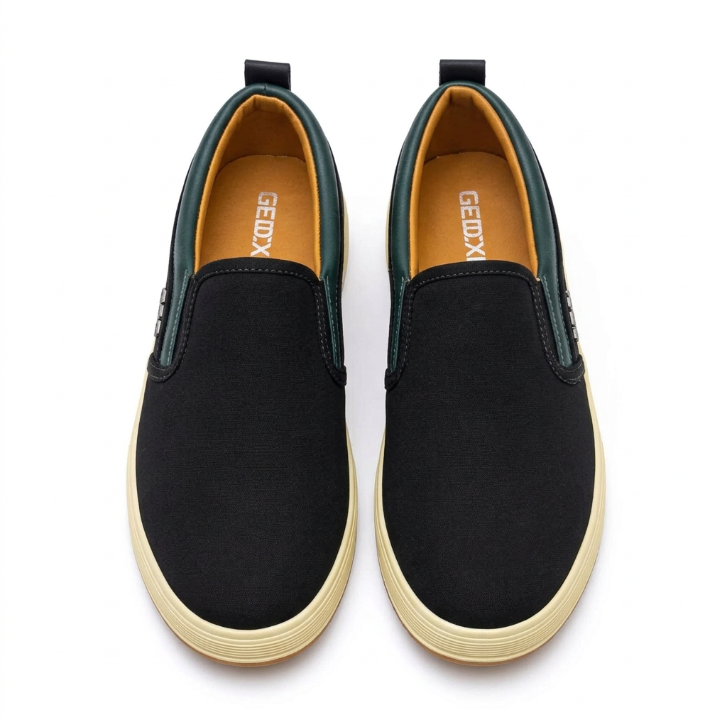 Straight-on black green-trim slip-on sneakers with cream ribbed soles