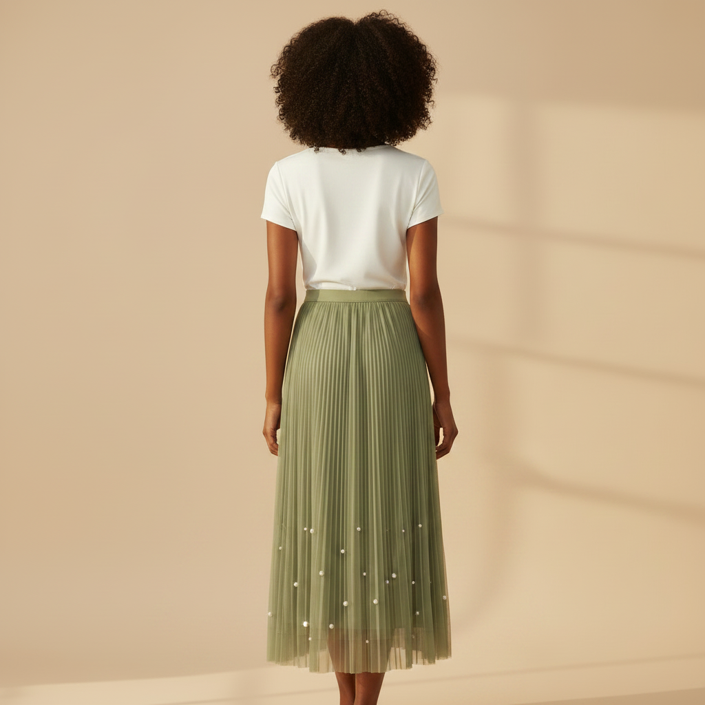 Nigerian woman wearing sage green pearl hem pleated midi skirt - back view
