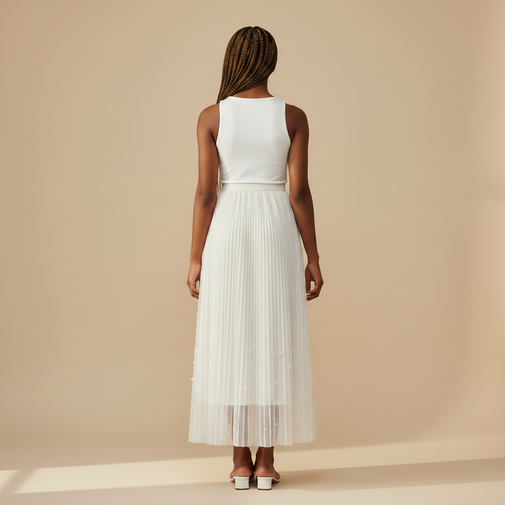 Nigerian girl wearing white pearl hem pleated midi skirt - back view