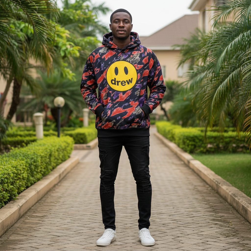 Abstract camo smiley hoodie front view on Nigerian male model