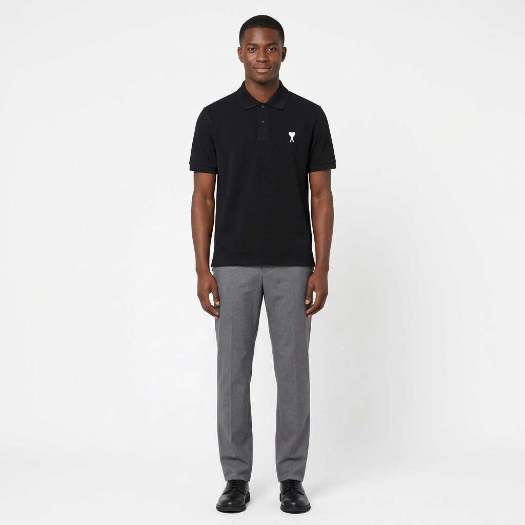 Full-body adult Black man wearing a black white heart-detail polo