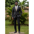 Nigerian male model wearing men's charcoal pinstripe 2-piece single-breasted formal suit, garden setting