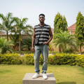 Nigerian male model wearing black and white fine-stripe sleeveless vest – full body lifestyle shot