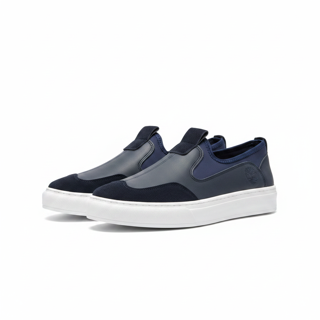 Men's navy blue two-tone slip-on platform sneaker ghost mannequin pair — front and side view on white background