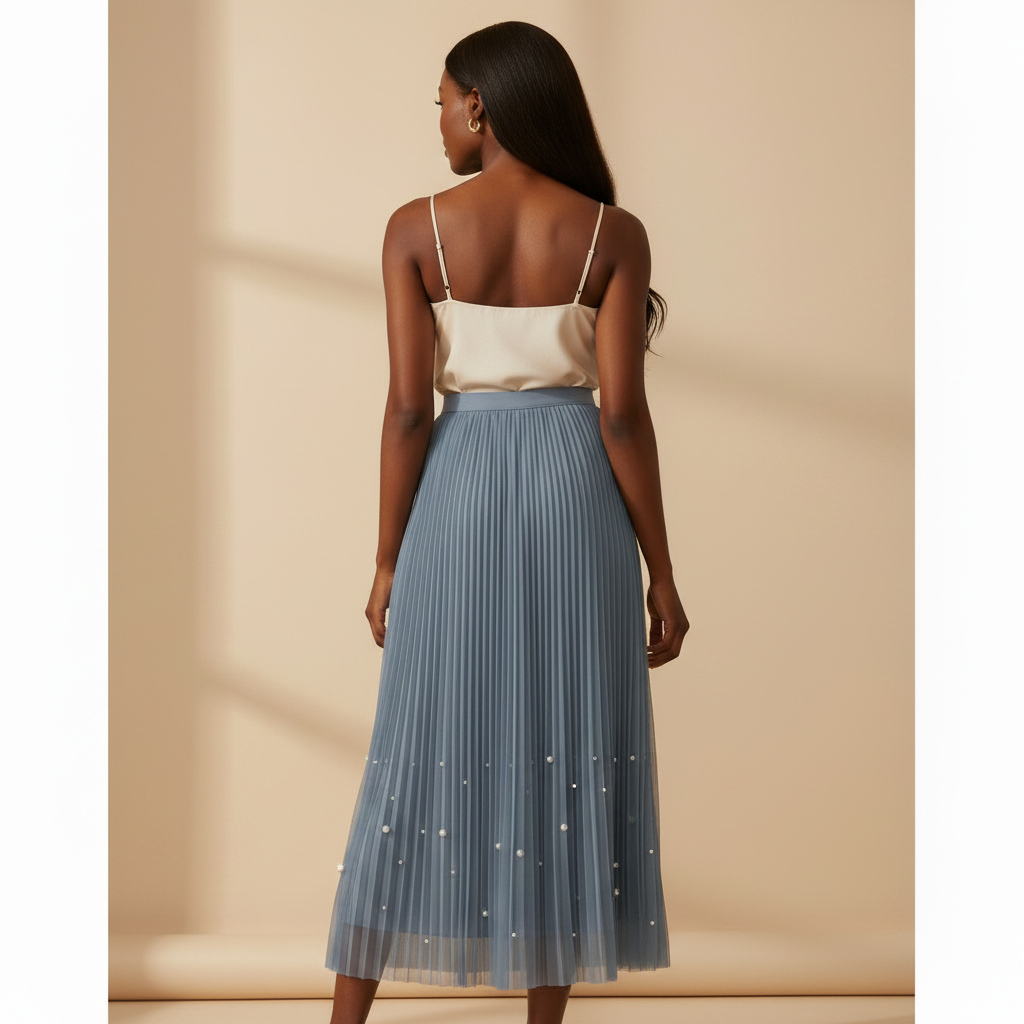 Nigerian woman wearing dusty blue pearl hem pleated midi skirt - back view