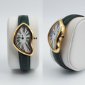 Asymmetric yellow gold watch with green Roman numerals and green strap front and side view