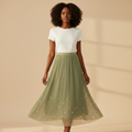 Nigerian woman wearing sage green pearl hem pleated midi skirt - front view