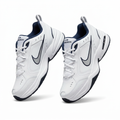 Ghost pair of white and silver low-top sneakers on white