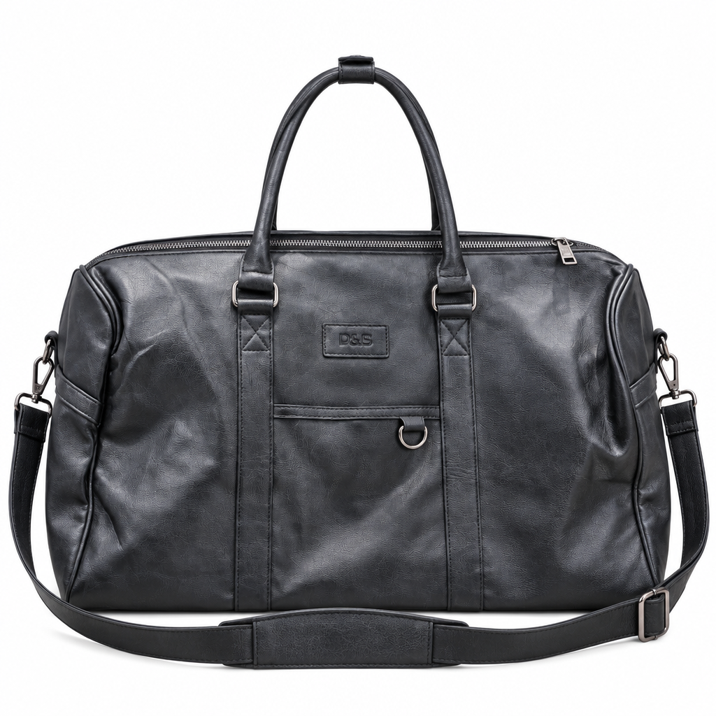 Black travel duffle bag with handles and shoulder strap on white