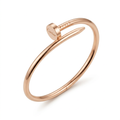 Rose-gold-tone polished nail-style bracelet on white