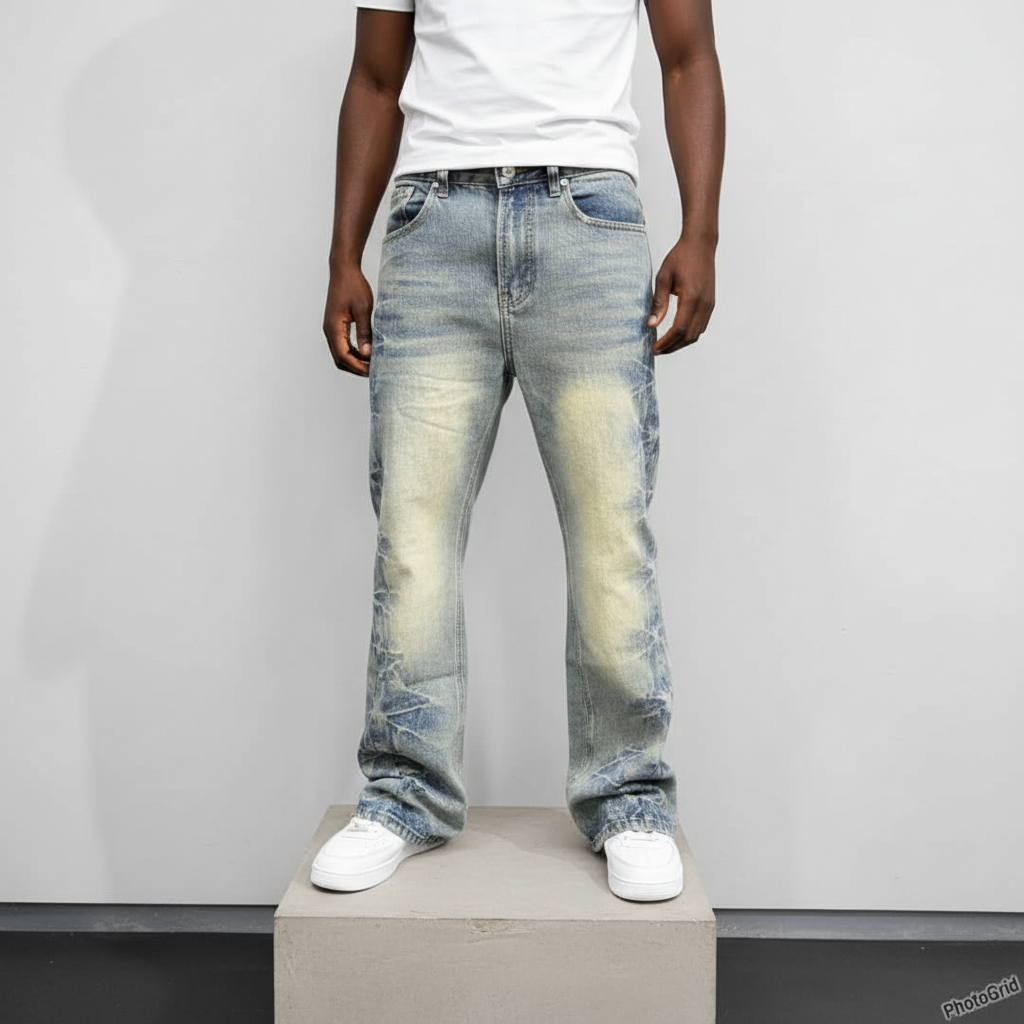Nigerian male model wearing light blue distressed flared jeans