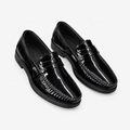 Black men's patent moc-toe loafers shown as a complete pair