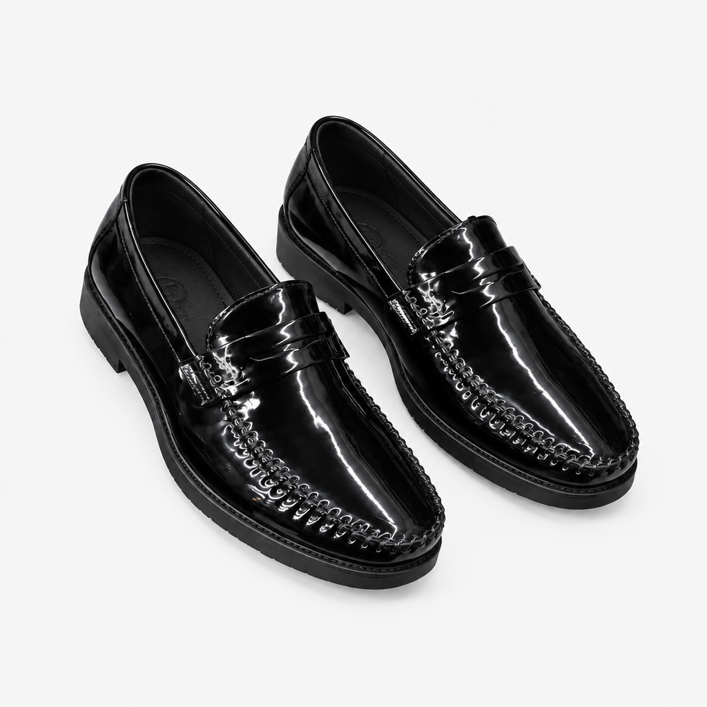 Black men's patent moc-toe loafers shown as a complete pair
