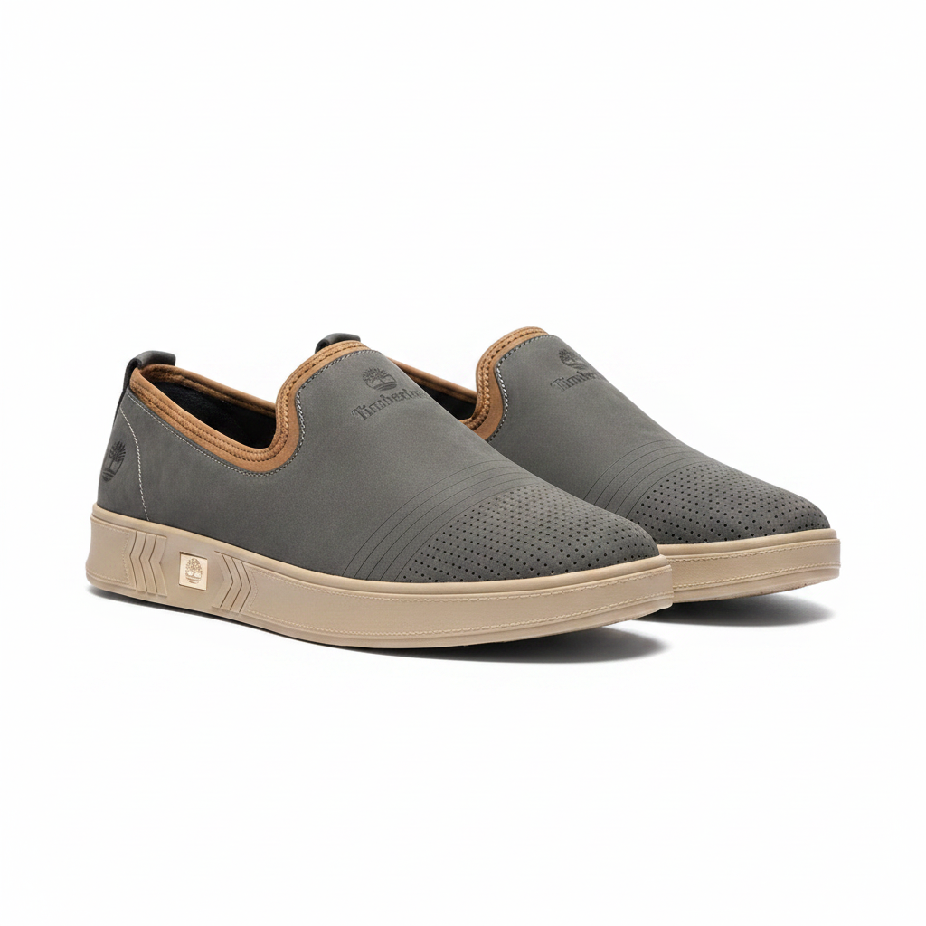 Men's slate grey nubuck leather slip-on sneakers with tan collar trim pair product shot
