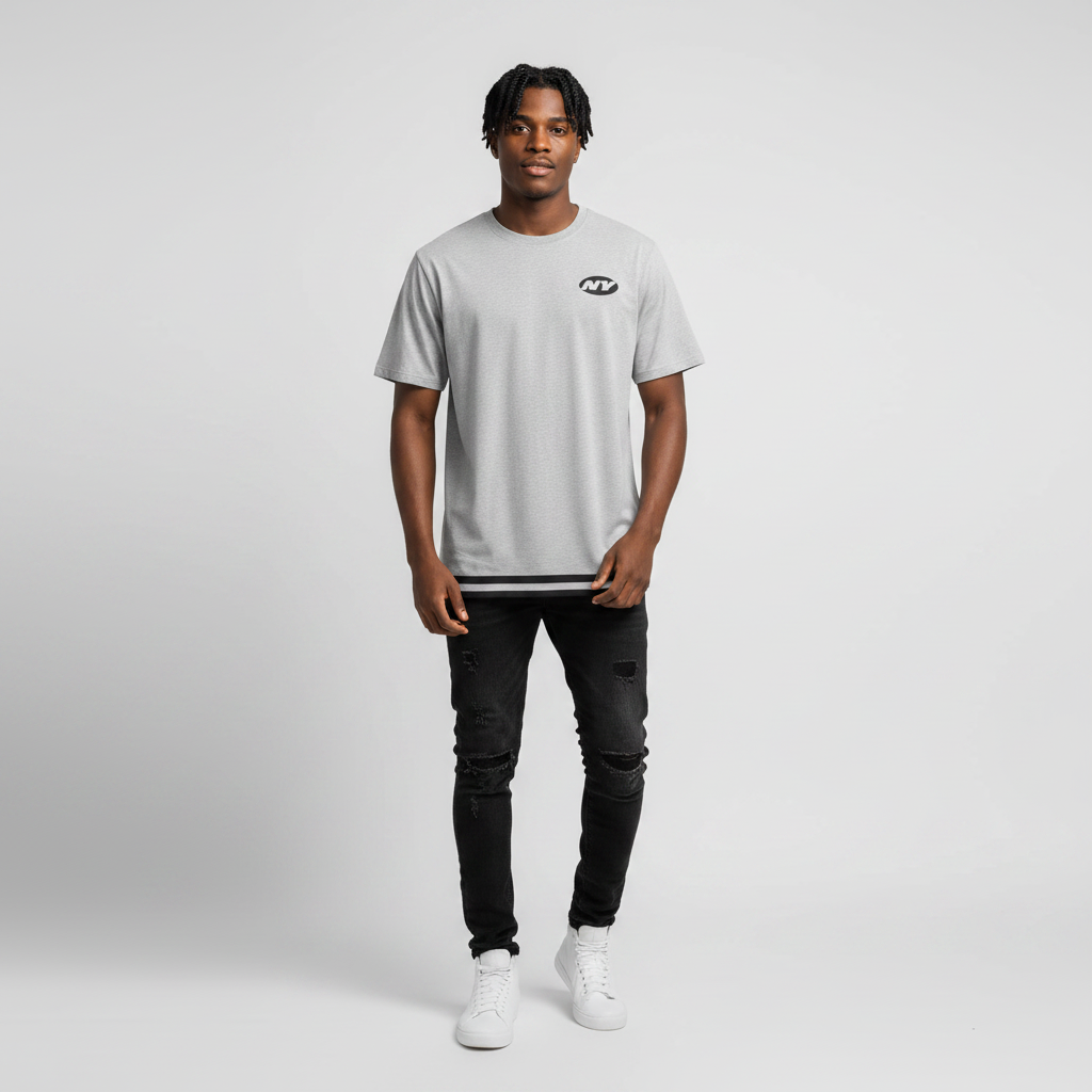 Young Nigerian male wearing light grey NY Jets striped hem graphic tee