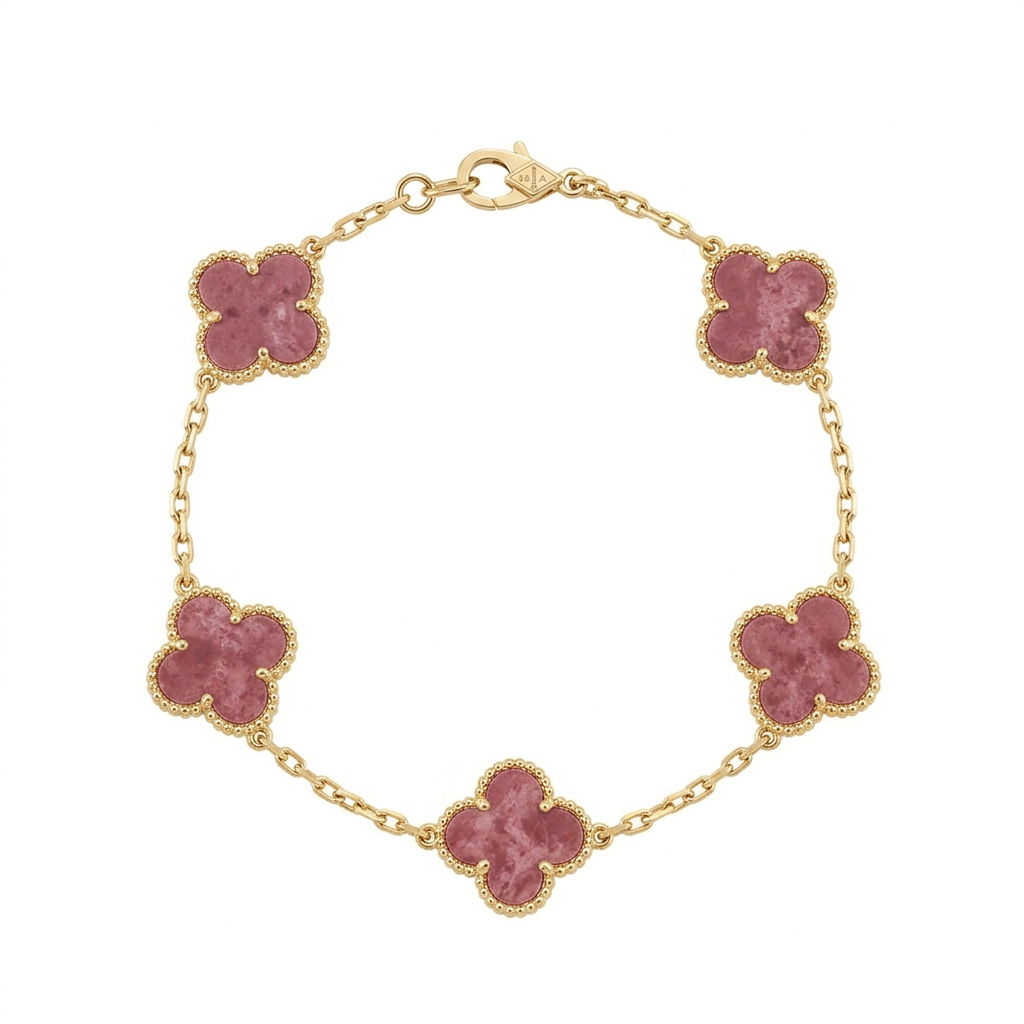 Gold-tone bracelet with five pink clover charms on white