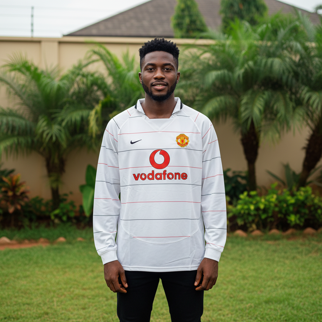 White long-sleeve retro football jersey with red and black pinstripes — Nigerian male model front view