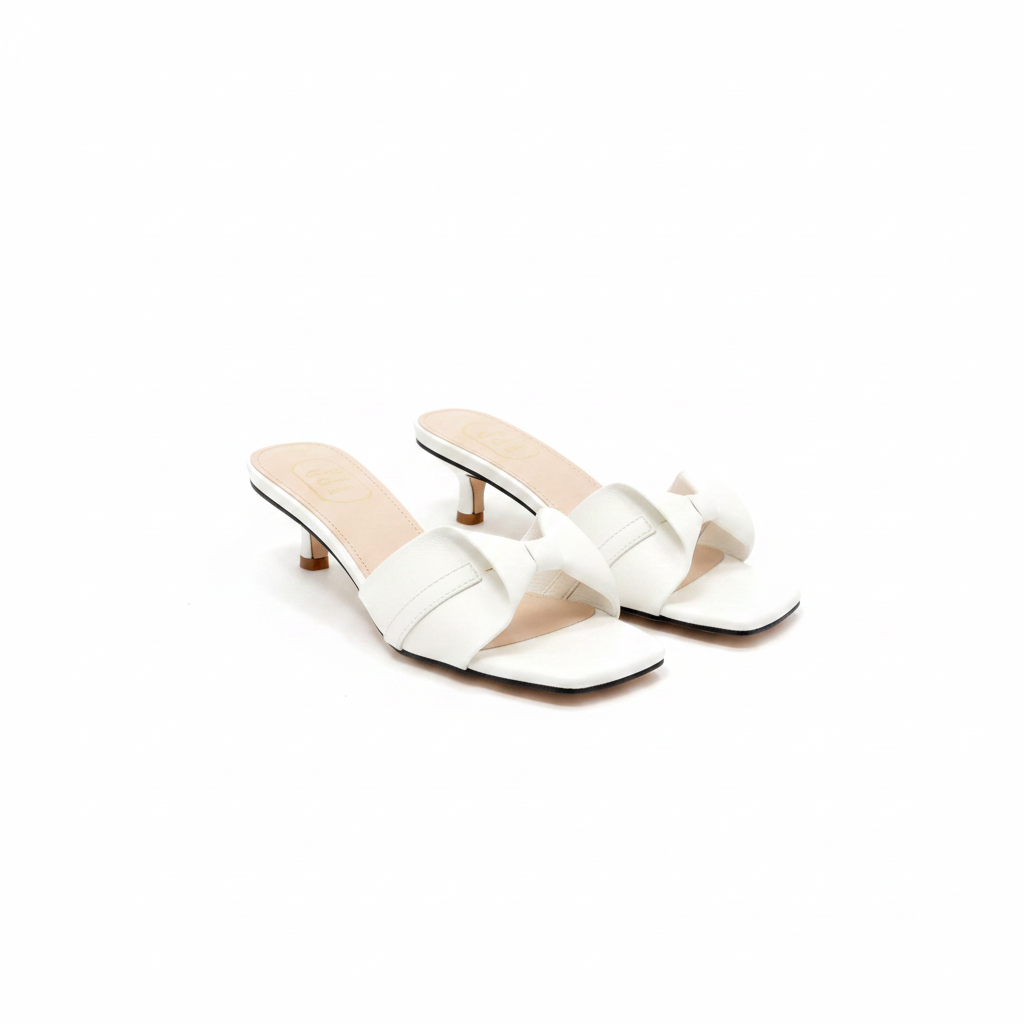 Ghost mannequin pair view of white crossover strap kitten heel slide mules