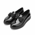 Women's black patent leather bow loafers ghost mannequin pair view