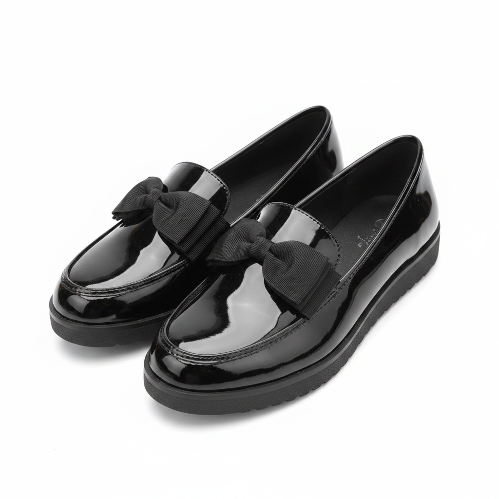 Women's black patent leather bow loafers ghost mannequin pair view