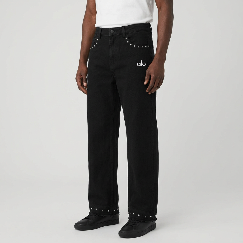 Model wearing black stud-trim wide-leg jeans