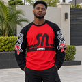 Black Nigerian adult model wearing a red and black graphic long-sleeve shirt