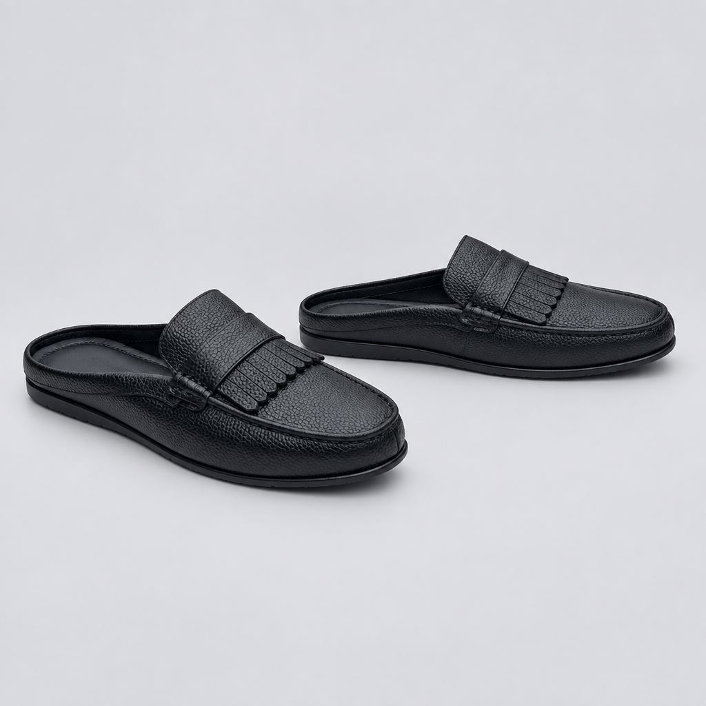 Men's black fringe kiltie backless mule slippers, front and side view
