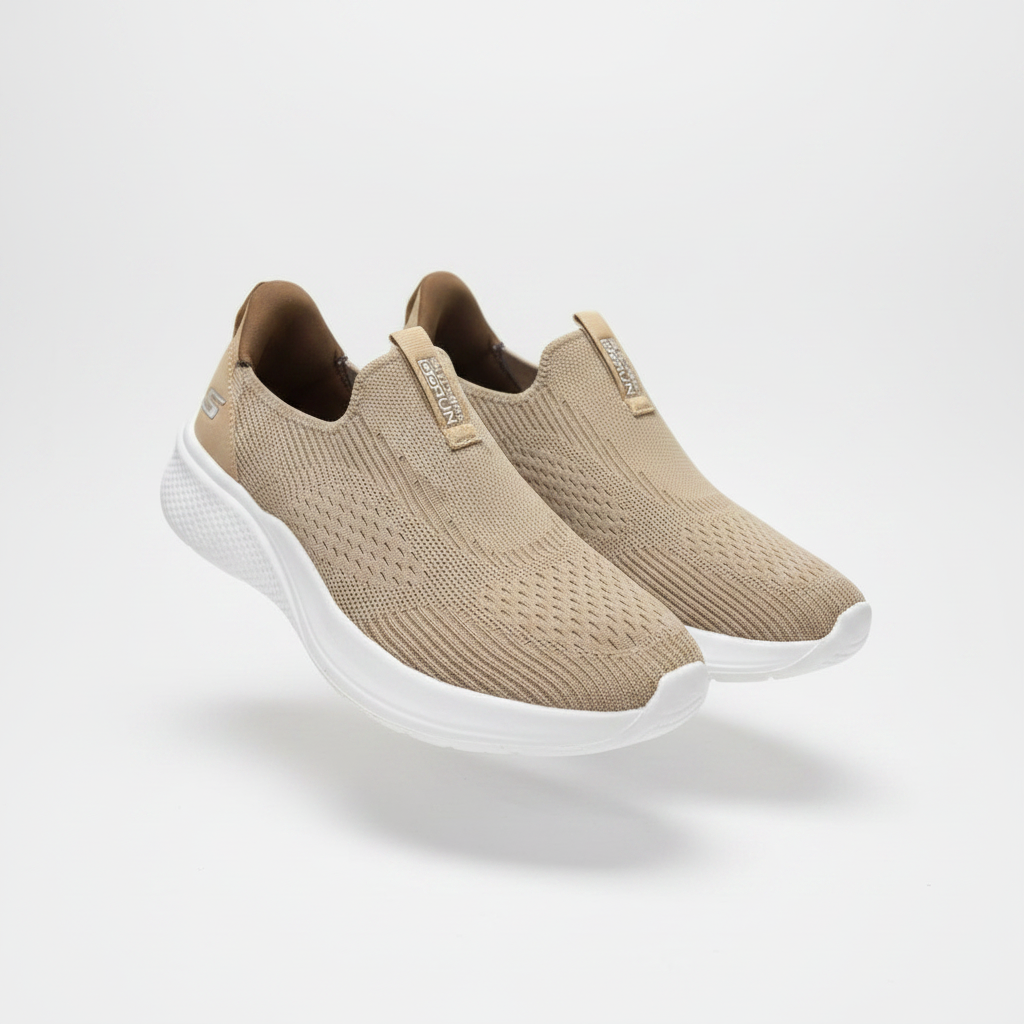 Beige knit slip-on sneakers with white sole, centred on a plain off-white background