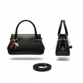 Black leather mini handbag ghost mannequin front and side view with red cherry charm and crossbody strap
