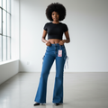 Nigerian female model wearing medium blue lace-up bell-bottom flare jeans front view