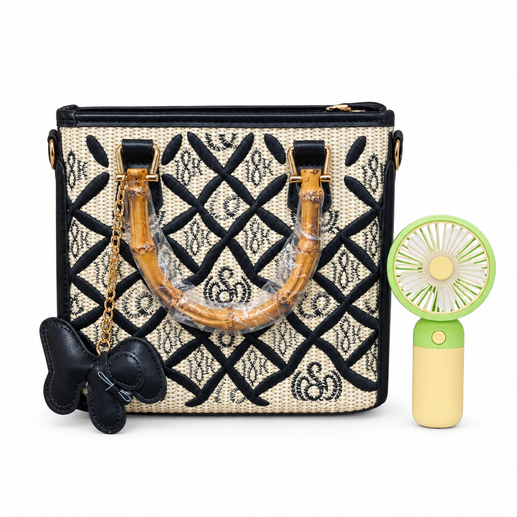 Black-and-cream patterned handbag with green mini hand fan on white background