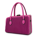 Fuchsia vertically ribbed twin-handle handbag with dark trim on white