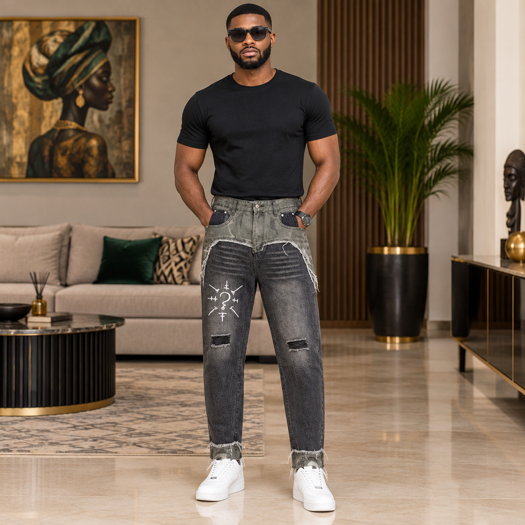 Man wearing grey patchwork distressed jeans